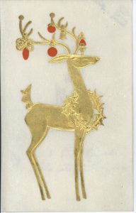 Holiday card featuring an embossed illustration of a golden reindeer decorated with red ornaments and a wreath around its neck.